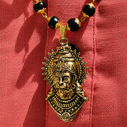 Decorative BajrangBali Pendant Karungali Mala on a red fabric background