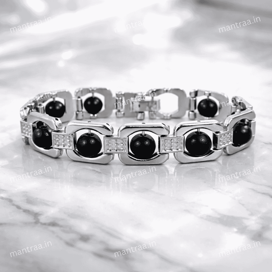 Silver Karungali bracelet with Real Karungali Ebony Wood on a marble surface