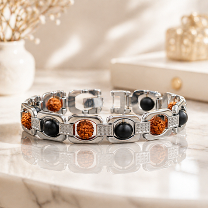 Silver-plated bracelet with Karungali and Rudraksha beads on a reflective surface