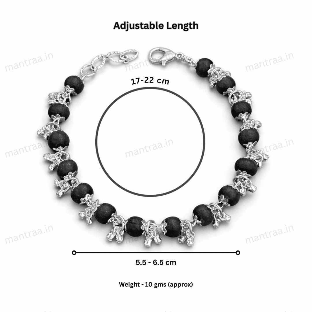 Karungali Ghunghroo bracelet with silver accents and measurements on a white background