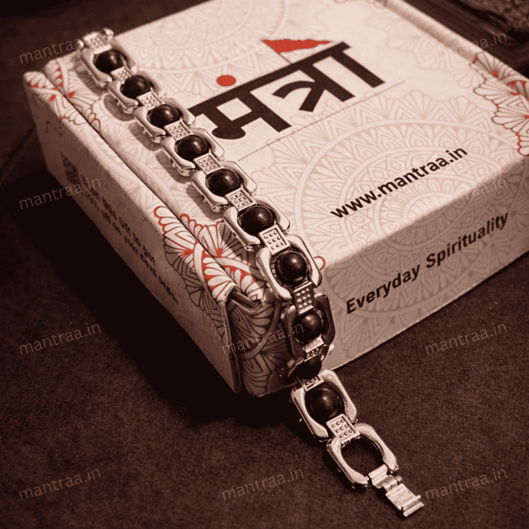 Silver bracelet with karungali beads on a branded mantraa box